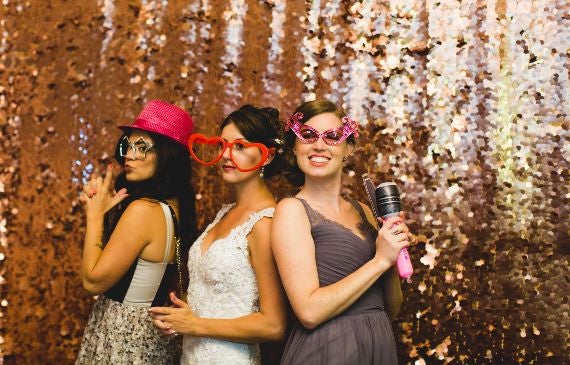Girls taking photos in a photo booth